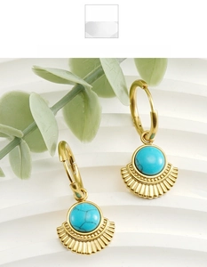 Detail of 18K gold-plated fan-shaped earrings with turquoise stones on a white background