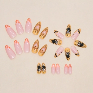 Halloween almond press-on nails with spider webs, bats, and pink glitter drip design