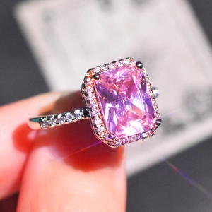 Luxurious silver ring with rectangular pink crystal and sparkling diamond halo accents