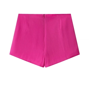 Detail view of the back of rose pink shorts with invisible zipper and smooth texture
