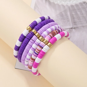 Bohemian multicolored Heishi bead bracelet set with purple clay and gold metal spacers