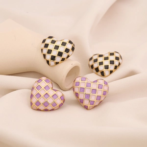 3D heart checkered stud earrings in black white and purple pink with gold edges