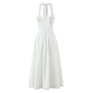 Elegant white backless halter maxi dress with a bow tie detail and high slit