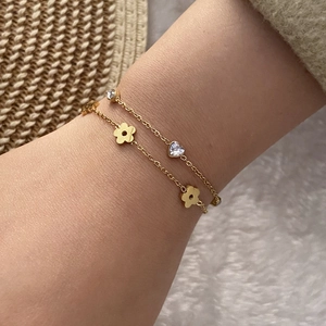 Zweilagiges Edelstahlarmband in Gold mit Herzkristall und Blumenanhängern