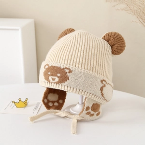 Detailed close-up of knitted bear ear hat featuring jacquard pattern and soft warm texture