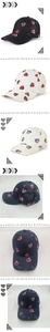 Detail of distressed baseball cap with heart print and mesh texture in multiple colors