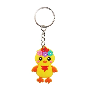 Detail of yellow acrylic chicken keychain with floral head decoration and metal ring