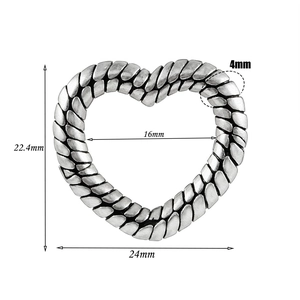 Detailed size specifications for vintage heart-shaped woven earrings in silver