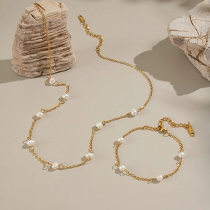 Elegant 18K gold-plated stainless steel necklace and bracelet set with natural pearls