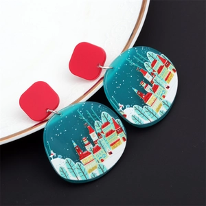 Détails des boucles d'oreilles en acrylique avec motif de scène de neige et clous rouges