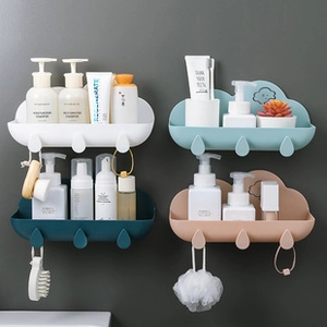 Detail view of cloud-shaped wall-mounted storage shelves with water droplet hooks in four colors