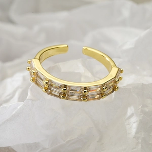 Exquisite gold adjustable ring featuring double rows of baguette-cut zircon stones