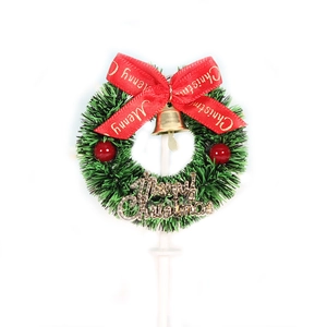 Christmas cake topper featuring green wreath with red bow and Merry Christmas sign