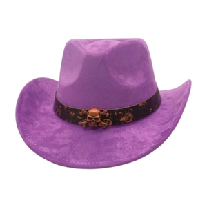 Detail of purple cowboy hat with skull band and bronze skull accessory on white background