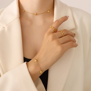 Ensemble bijoux collier et bracelet en acier inoxydable doré avec pendentif cœur