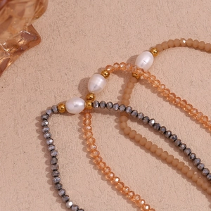 Detailed view of handmade beaded necklace with freshwater pearls and faceted crystals