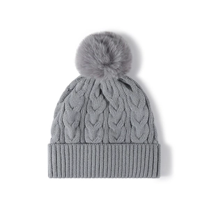 Light gray thick cable knit winter beanie with a large fluffy pom-pom for women