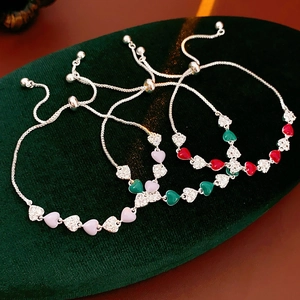 Detail of vintage heart bracelets with enamel and cubic zirconia in various colors