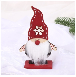 Detail of wooden Christmas gnome with red snowflake hat and base for festive decor