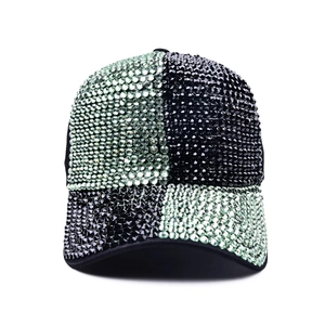 Close-up of baseball cap with green and black checkered sequins and high-density rhinestones
