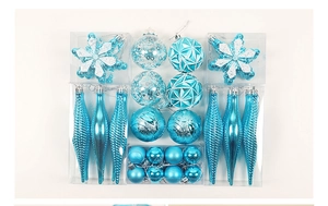 Macro view of blue Christmas ball ornaments with snowflake patterns and glitter details
