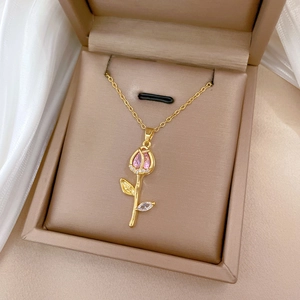 Detail of pink tulip necklace with zircon pendant in a premium beige jewelry gift box