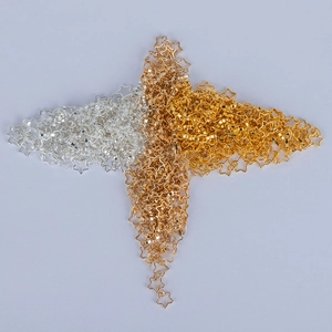 Collection of hollow star metal charms in silver, gold, and champagne gold finishes