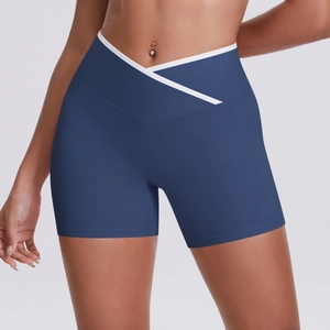 Detail of high-waist yoga shorts with contrast white V-shaped cross waistband design