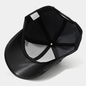 Internal view of black PU leather baseball cap with stitched seams and care label