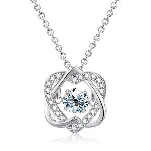 Sparkling silver interlocking heart pendant necklace with shimmering round-cut crystals