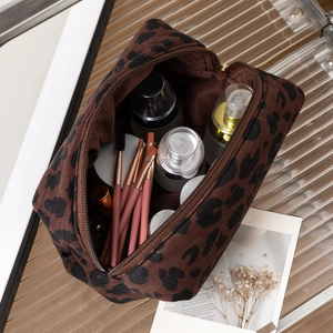 Large leopard print makeup bag with zipper closure and spacious interior storage