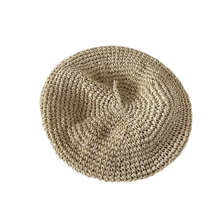 Handcrafted straw beret hat for women with minimalist knit texture and natural beige finish