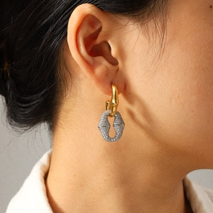Elegant 18k gold stainless steel earrings with sparkling full diamond pavé inlay on model