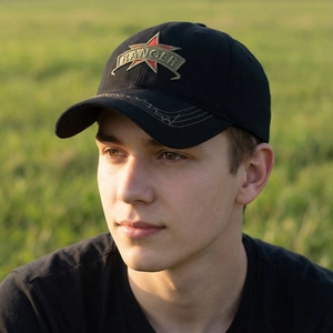 Men's black tactical baseball cap with Ranger embroidery and red star on outdoor model