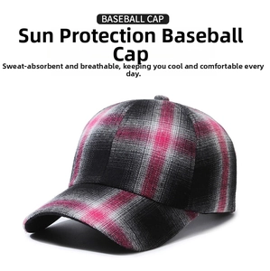 Close-up of pink and grey plaid texture and cotton fabric on a baseball cap