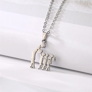 Macro shot of silver stainless steel pendant featuring a mother and three children silhouette