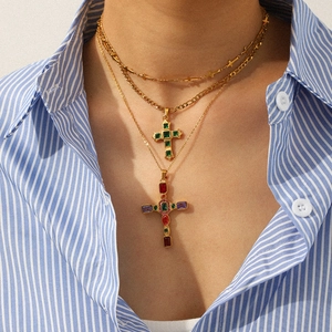 Layered gold stainless steel necklaces with emerald and multicolor gemstone cross pendants