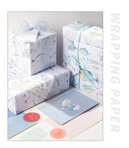 Macro view of Colorful Ocean wrapping paper with hand-drawn fish and coral patterns