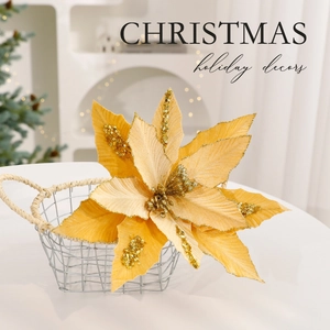 Sparkling gold artificial Christmas flower in metal basket for festive home holiday decor