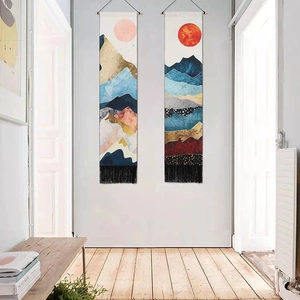 Modern abstract landscape wall tapestry with gold sun and mountains with black tassels