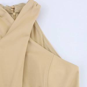 Detail of khaki halter dress neck with two buttons and back zipper closure