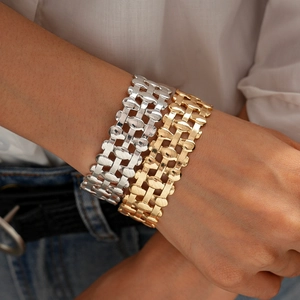 Three-layer hollow woven oval bangles in gold and silver finish for a bold metal look