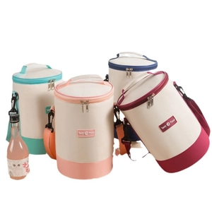 Insulated cylindrical lunch bags with adjustable shoulder straps in multiple vibrant colors