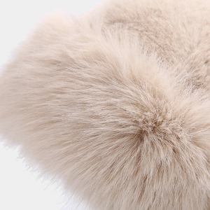 Detailed macro view of soft faux rabbit fur texture on a warm winter bucket hat