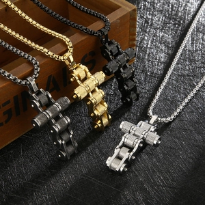 Industrial style cross pendant necklace in four colors for men on a textured surface