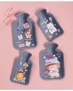 Flat lay of four gray plush hot water bottles with cute cartoon prints on a pink background
