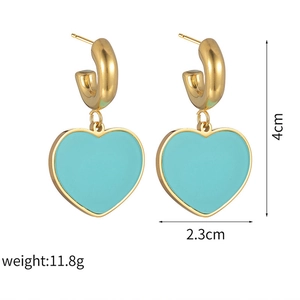 Detailed view of turquoise heart earrings with size dimensions and gold-tone finish