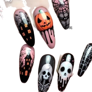 Halloween almond press-on nails featuring pumpkin, skull, and ghost designs in pink and orange