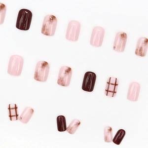 Pink and brown marble plaid press-on nails set with glossy finish on white background