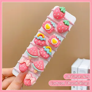 Detailed view of 10-piece mini hair ties set with cute pink cartoon fruit designs